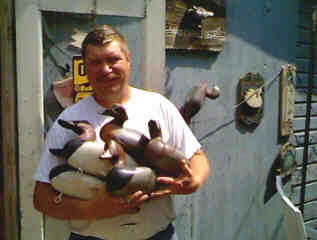 Bob Jobes in front of his decoy shop