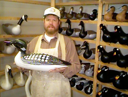 Joey Jobes in his decoy shop with Full size Loon decoy