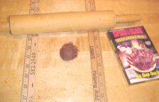 Place meat mixture between two yardstick in plastic or waxed paper.
